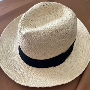 Straw hat with black details.